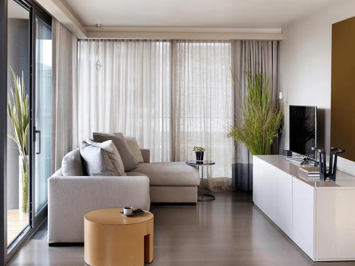 Motorized roller shades on tall Nora windows